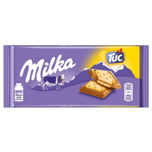 Front of Milka Tuc pack displaying the brand logo, biscuit sandwich image, and the pack size of 87g.