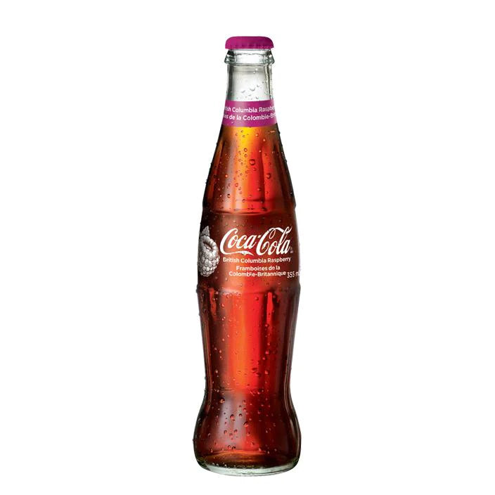 Front of Coca Cola British Columbia Raspberry bottle showing red Coca Cola logo, raspberry flavour label, and 355ml size