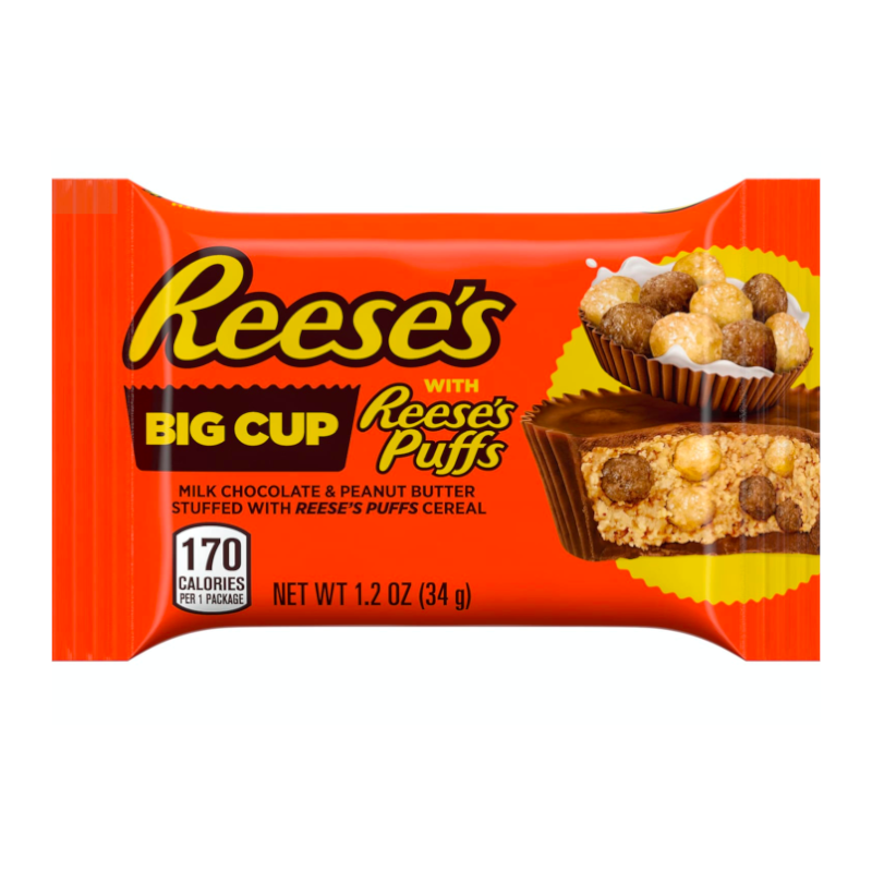 Front of Reese's Big Cup with Reese's Puffs packaging showing orange background, milk chocolate and peanut butter cup, and cereal pieces (36g)