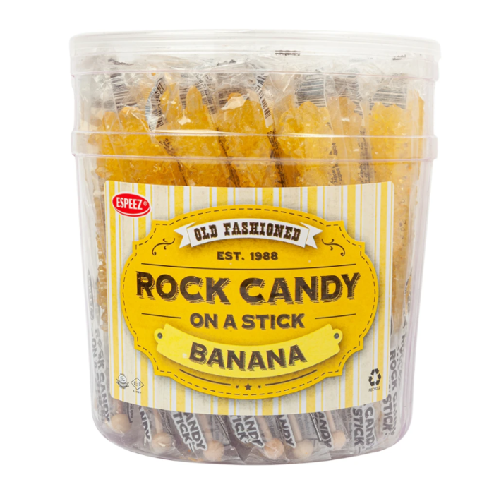 Front of Espeez Rock Candy on a Stick Banana packaging showing yellow label with logo and banana-flavoured rock candy (23g)