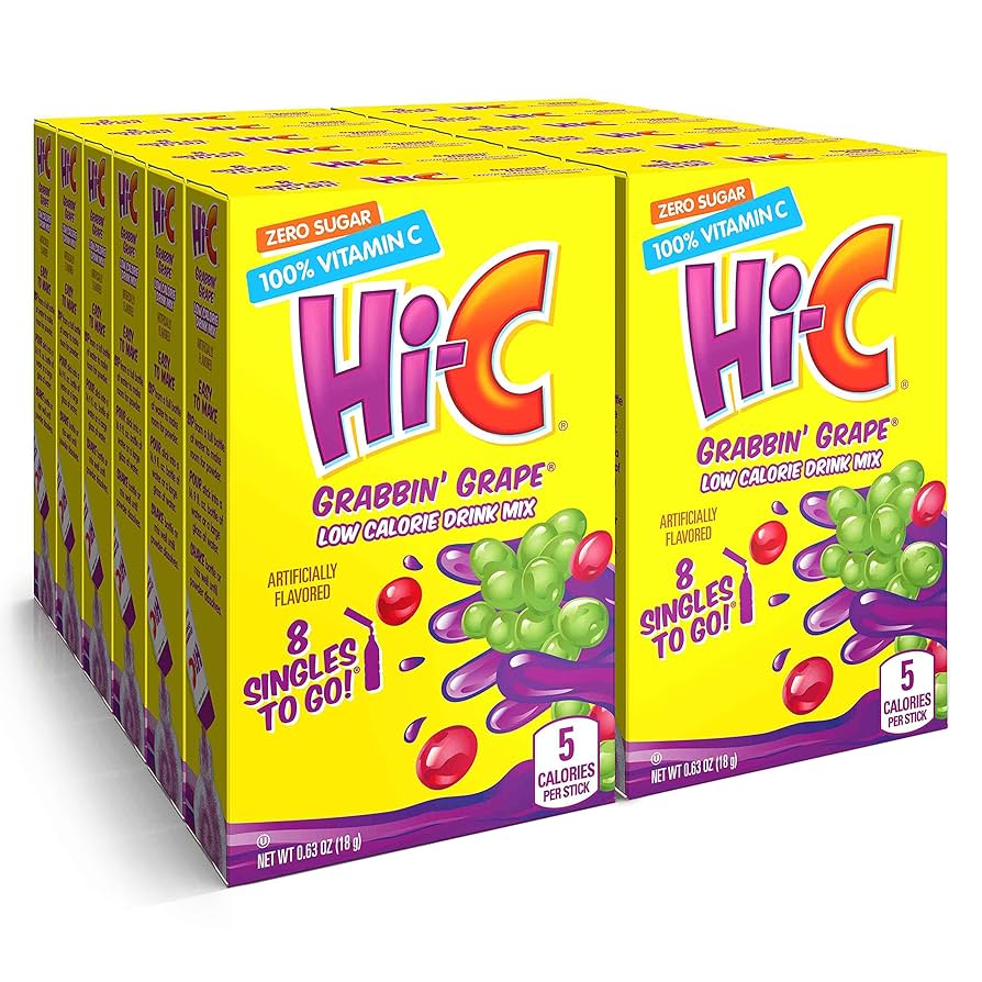 Front of Hi-C Grabbin’ Grape Singles To Go box showing vibrant yellow packaging, grape illustration, and 12 pack quantity (low calorie drink mix).