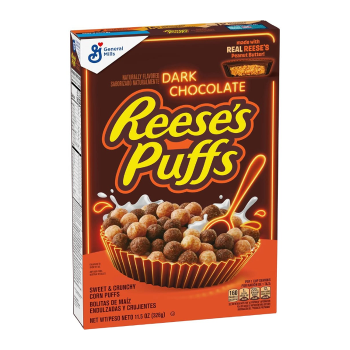 Front of a box of Reese's Puffs Dark Chocolate Cereal showing the logo, dark chocolate flavour, and corn puffs in a bowl (326g pack)