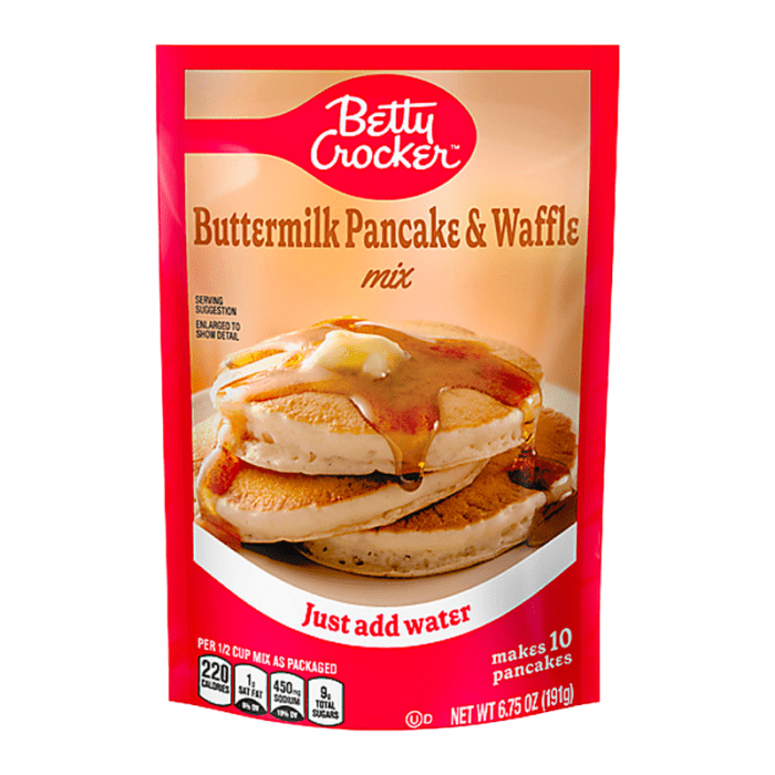 Front of Betty Crocker Buttermilk Pancake & Waffle Mix showing logo, product name, and image of pancakes with syrup and butter (191g pack)