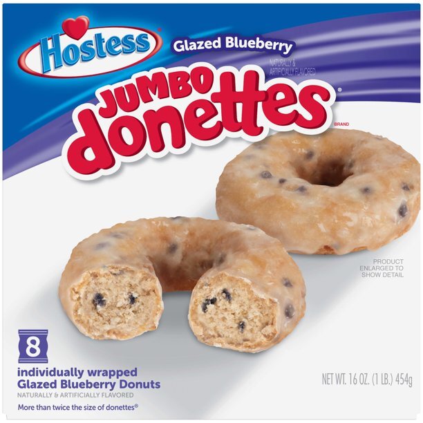 Front of Hostess Jumbo Donettes Glazed Blueberry packaging showing the product title, blueberry flavour, and 8 pack (454g)