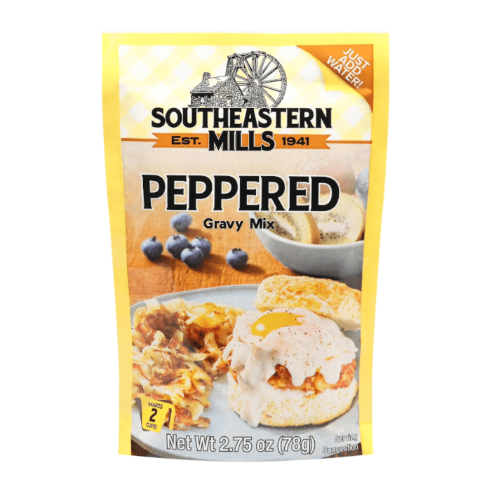 Front of Southeastern Mills Peppered Gravy Mix package displaying the logo, peppered flavour, and serving suggestion with biscuits and eggs (78g)
