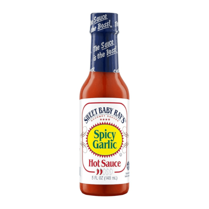 Front of Sweet Baby Ray's Spicy Garlic Hot Sauce bottle displaying bold logo, spicy garlic flavour label, and 148ml size
