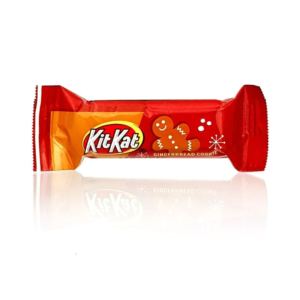 Front of a Kit Kat Miniatures Gingerbread Cookie wrapper showing the brand logo, gingerbread cookie flavour graphic, and 14g pack size.