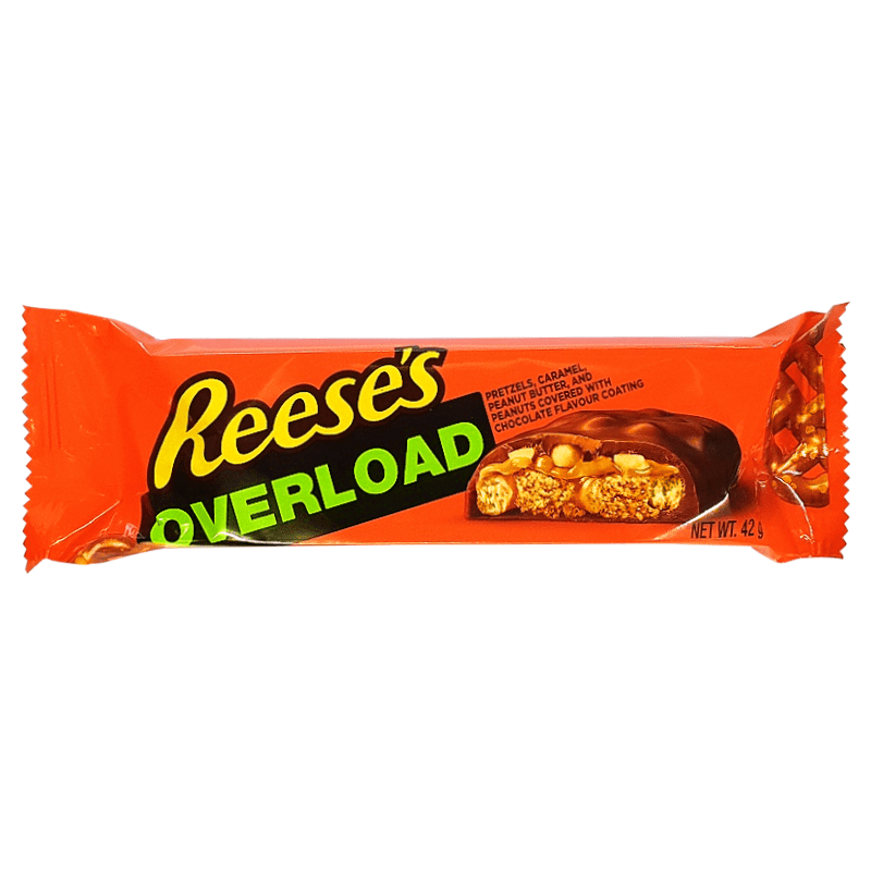 Front of a Reese's Overload (42g) wrapper showing bold orange background, black text, and images of pretzels and caramel pieces.
